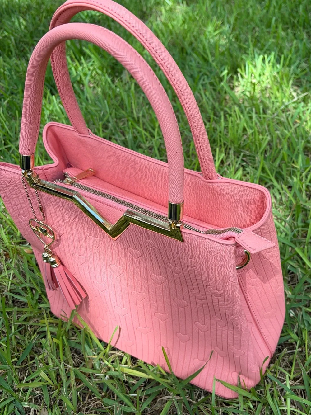 Crossi Pink Structured Heart-Embossed Tote Bag with Tassel Charm